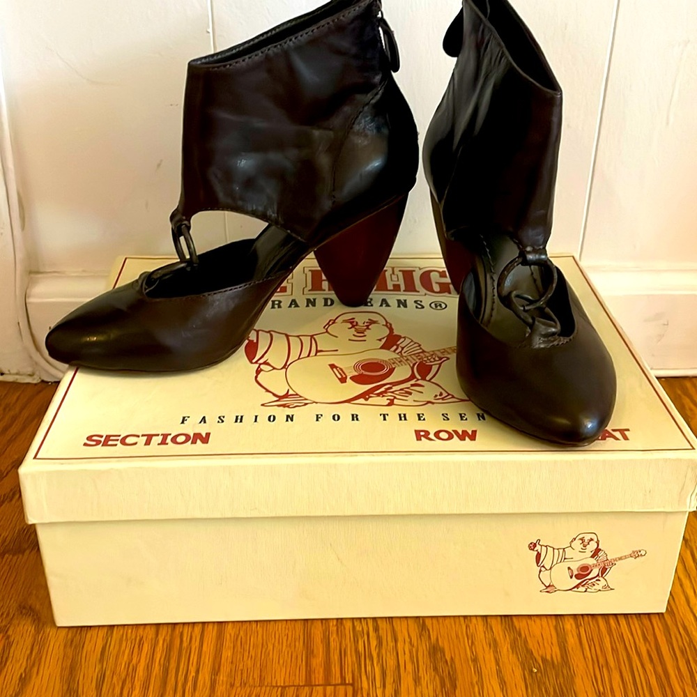 Dark brown leather 2 1/2 inch heel shoe booties with bronze ring detail.